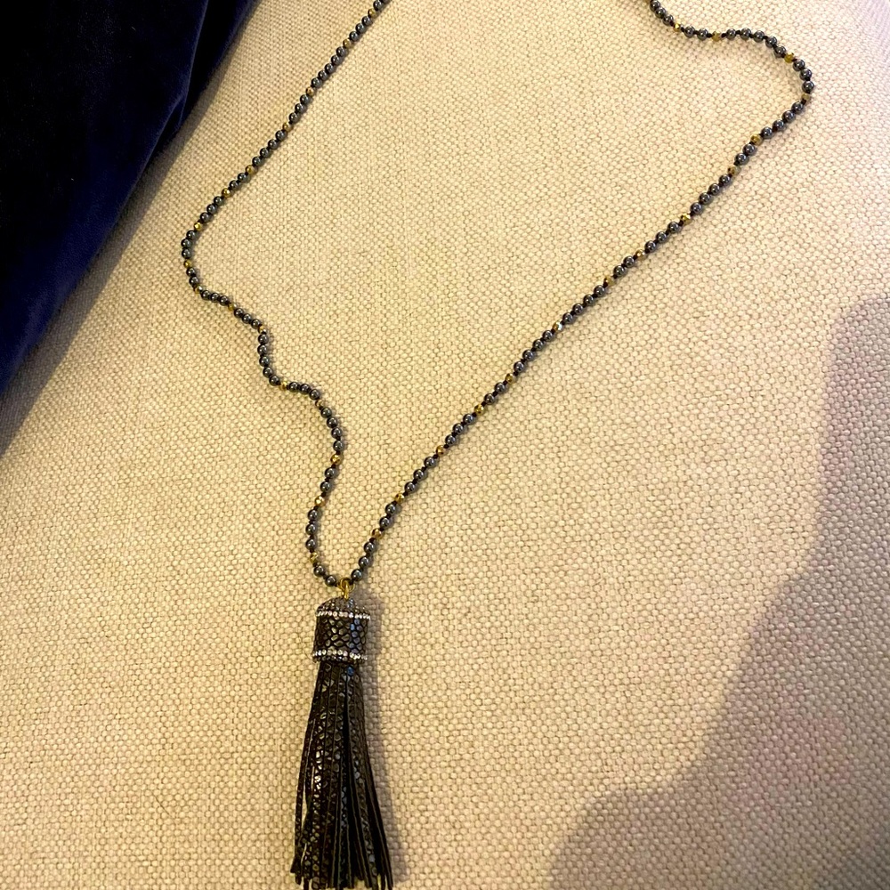 Faux leather tassel necklace with rhinestones